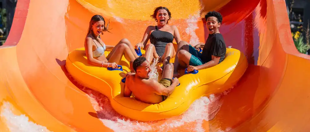 Group laughing in a pool